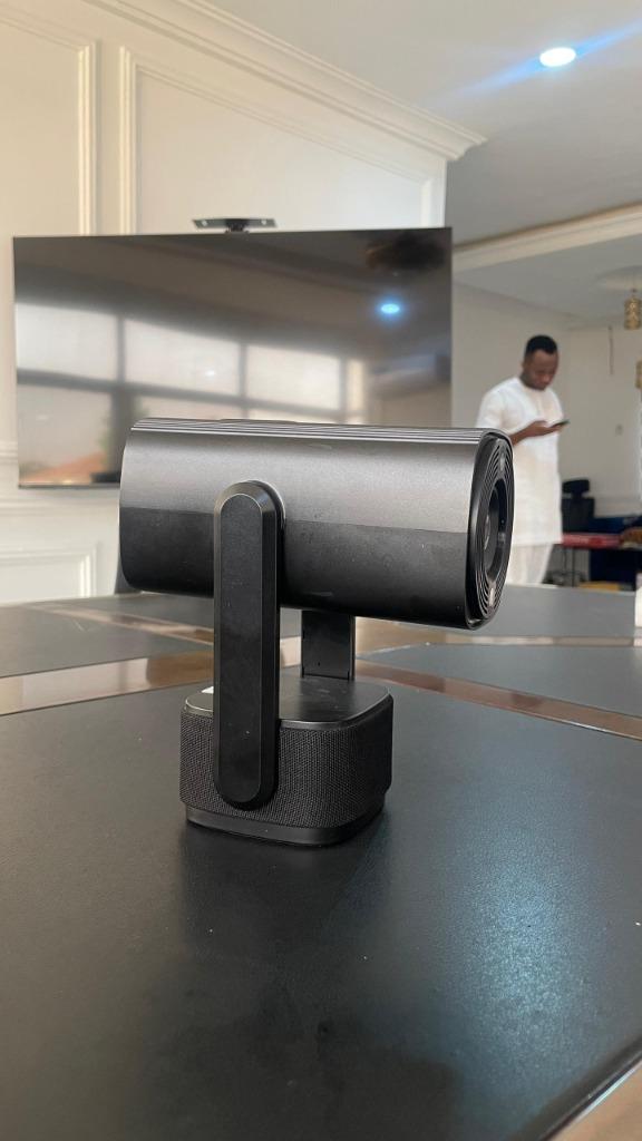 Side view of the Diyaa device on a stand, showing its swivel arm and speaker base